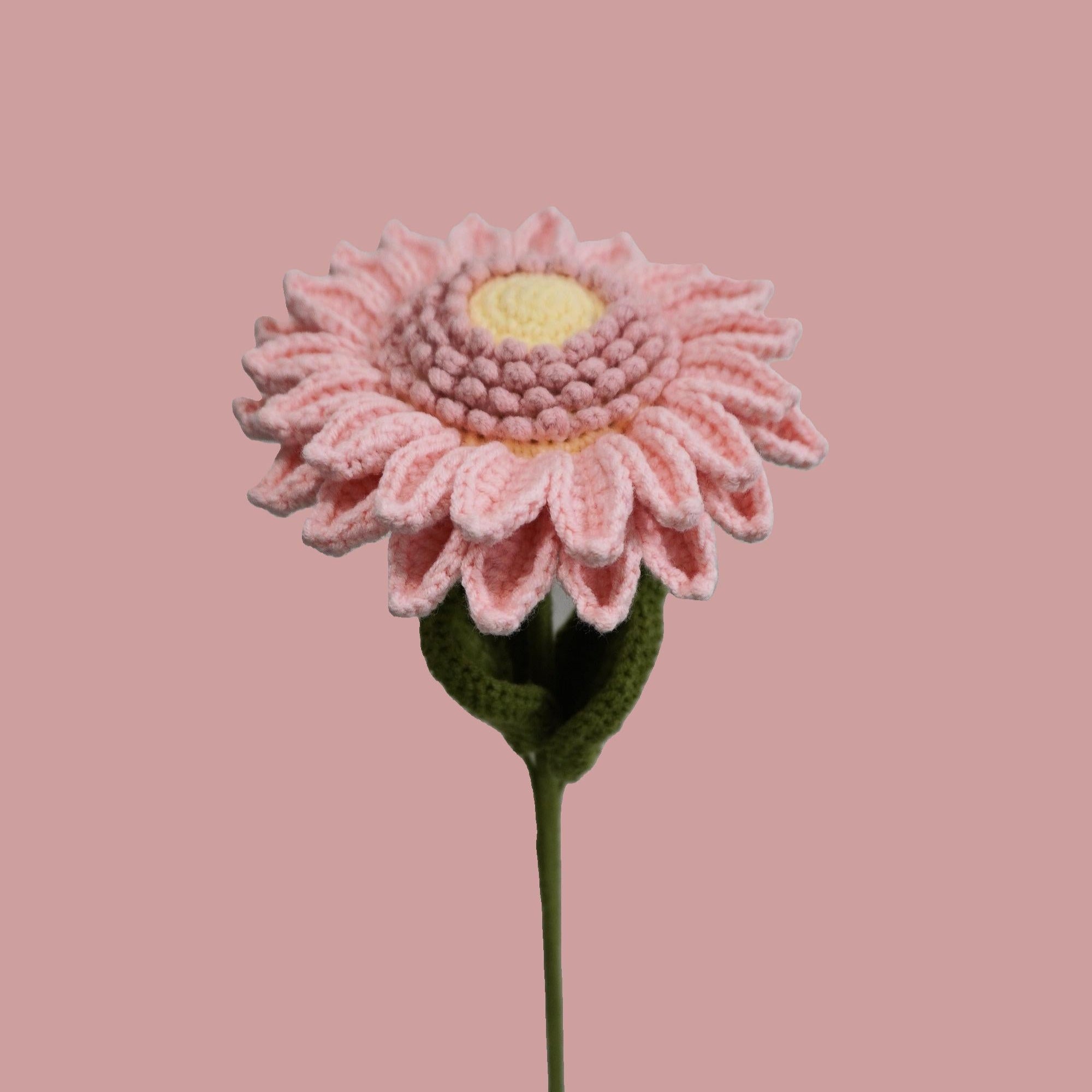 Close-up of handmade crochet sunflower with pink petals – eco-friendly floral gift
