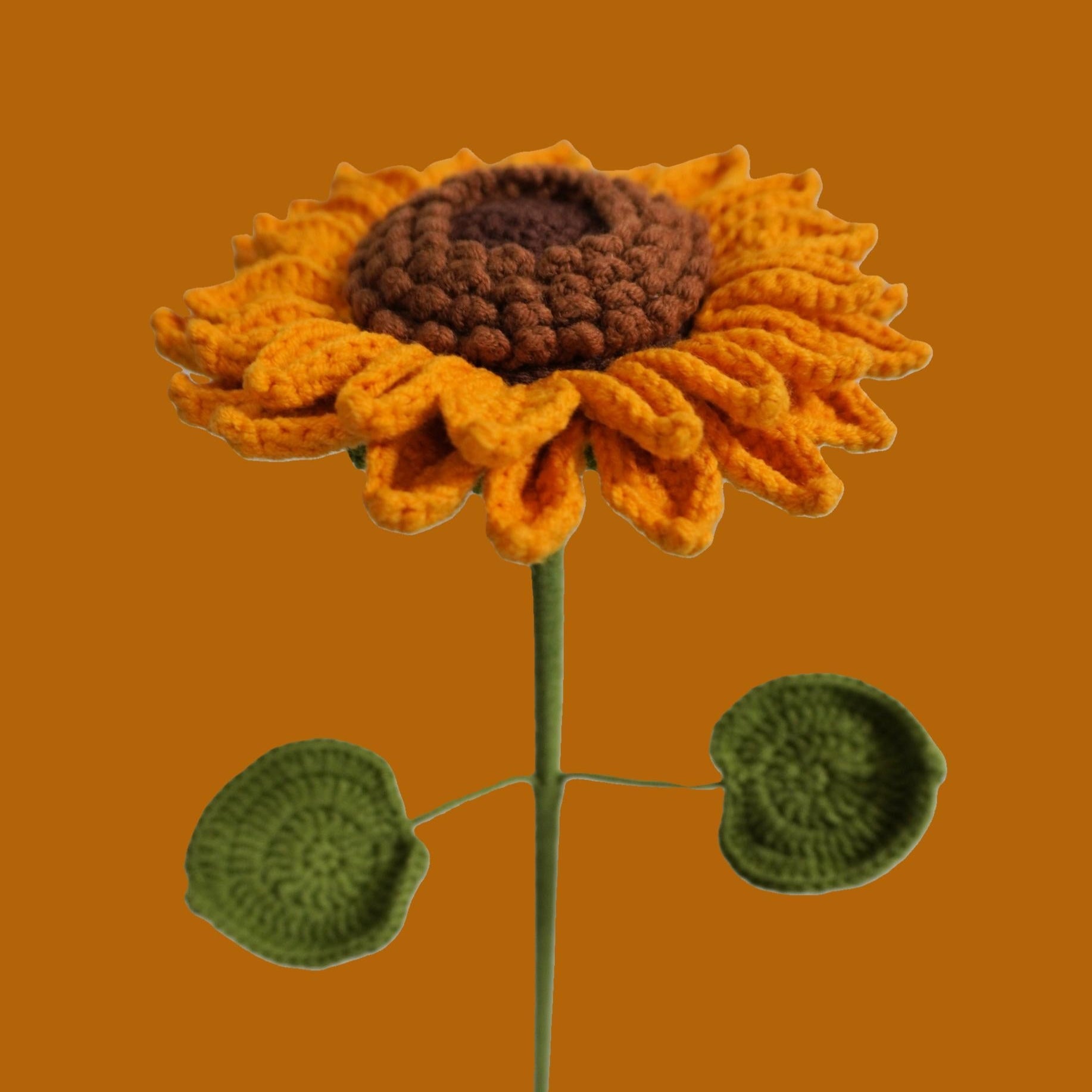Close-up of handmade crochet sunflower with gold petals – eco-friendly floral gift
