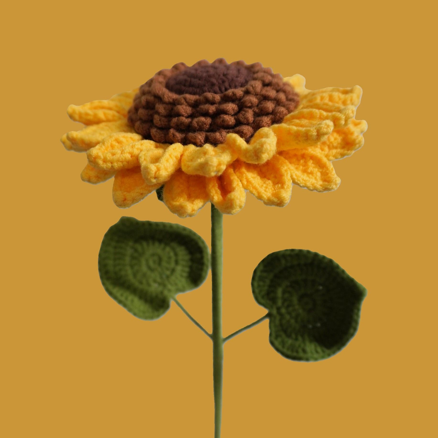 Close-up of handmade crochet sunflower with yellow petals – eco-friendly floral gift
