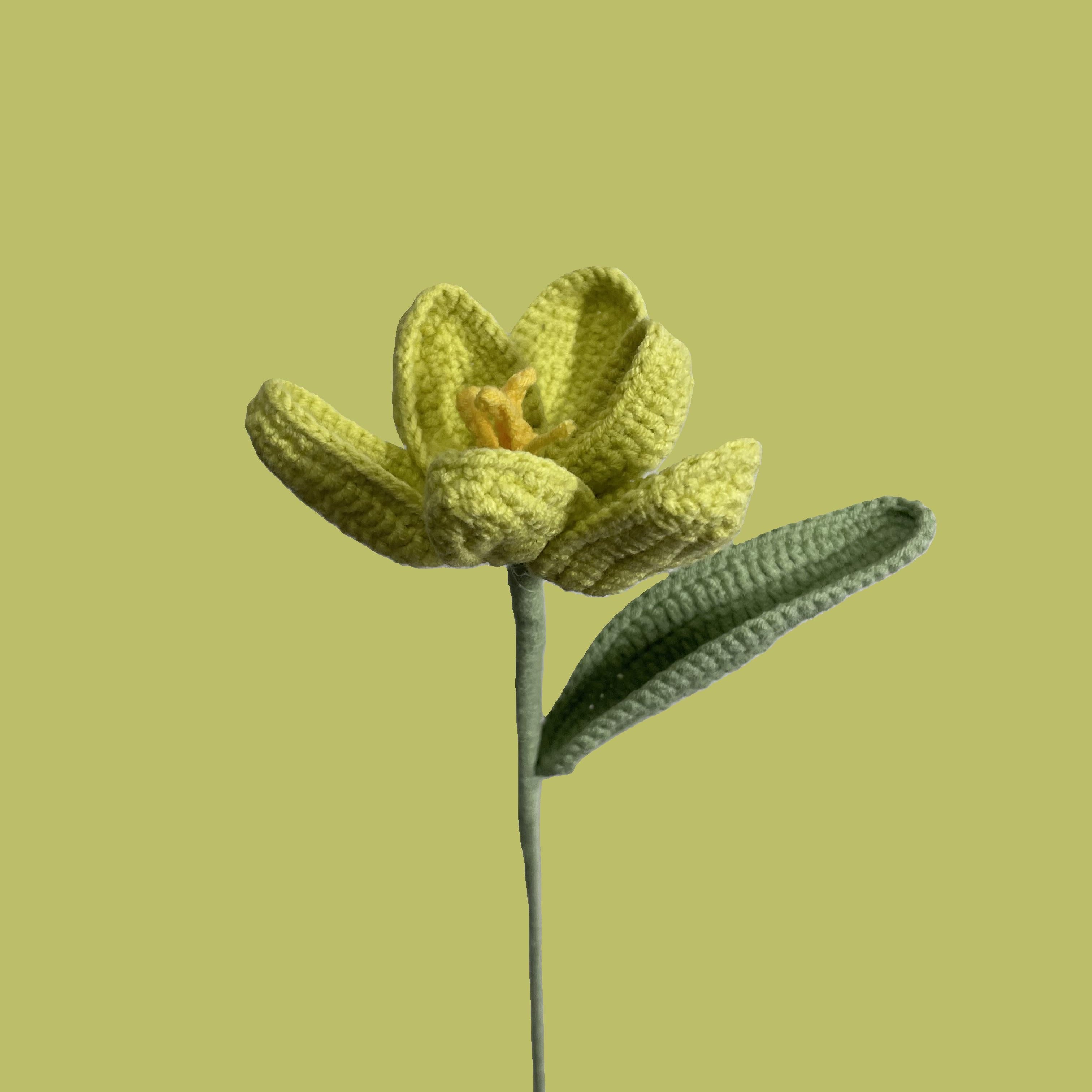 Handmade crochet tulip flower in yellow yarn, eco-friendly and perfect for sustainable home decor or gifting
