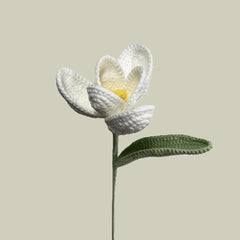 Handmade crochet tulip flower in white yarn, eco-friendly and perfect for sustainable home decor or gifting
