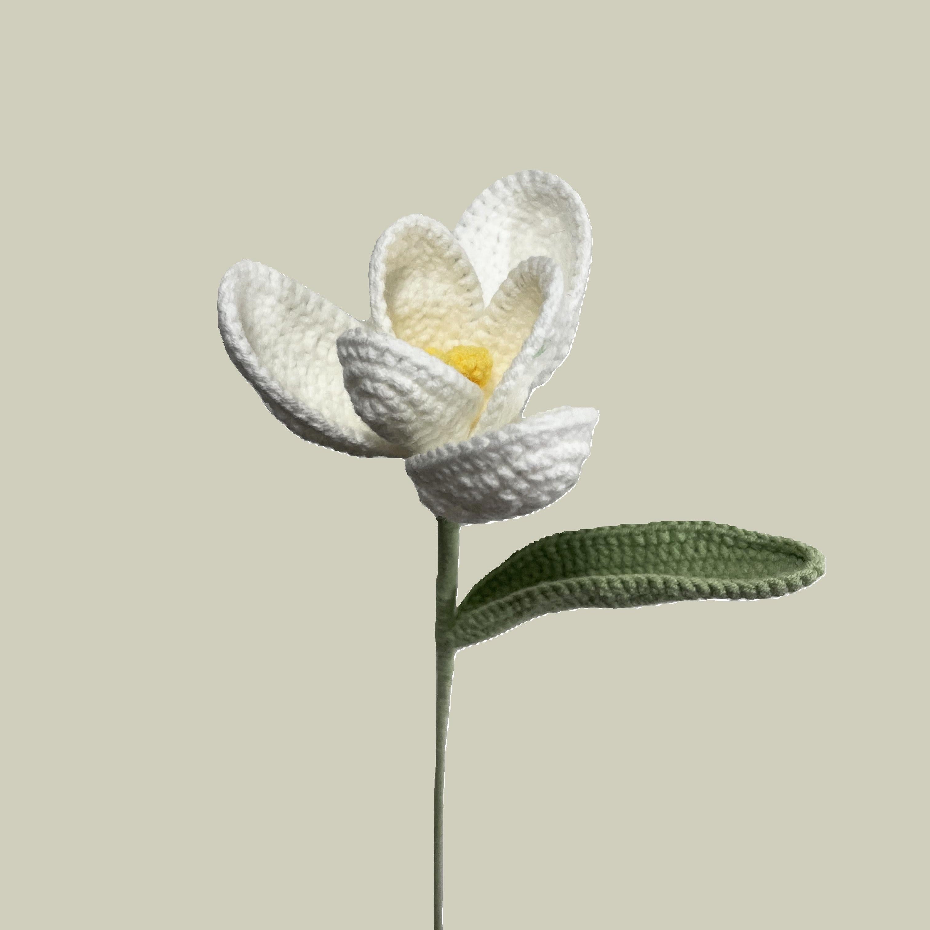Handmade crochet tulip flower in white yarn, eco-friendly and perfect for sustainable home decor or gifting

