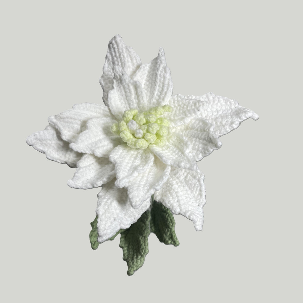 Handmade crochet Chinese rose flower in white yarn with green leaves for sustainable home decor and gifts
