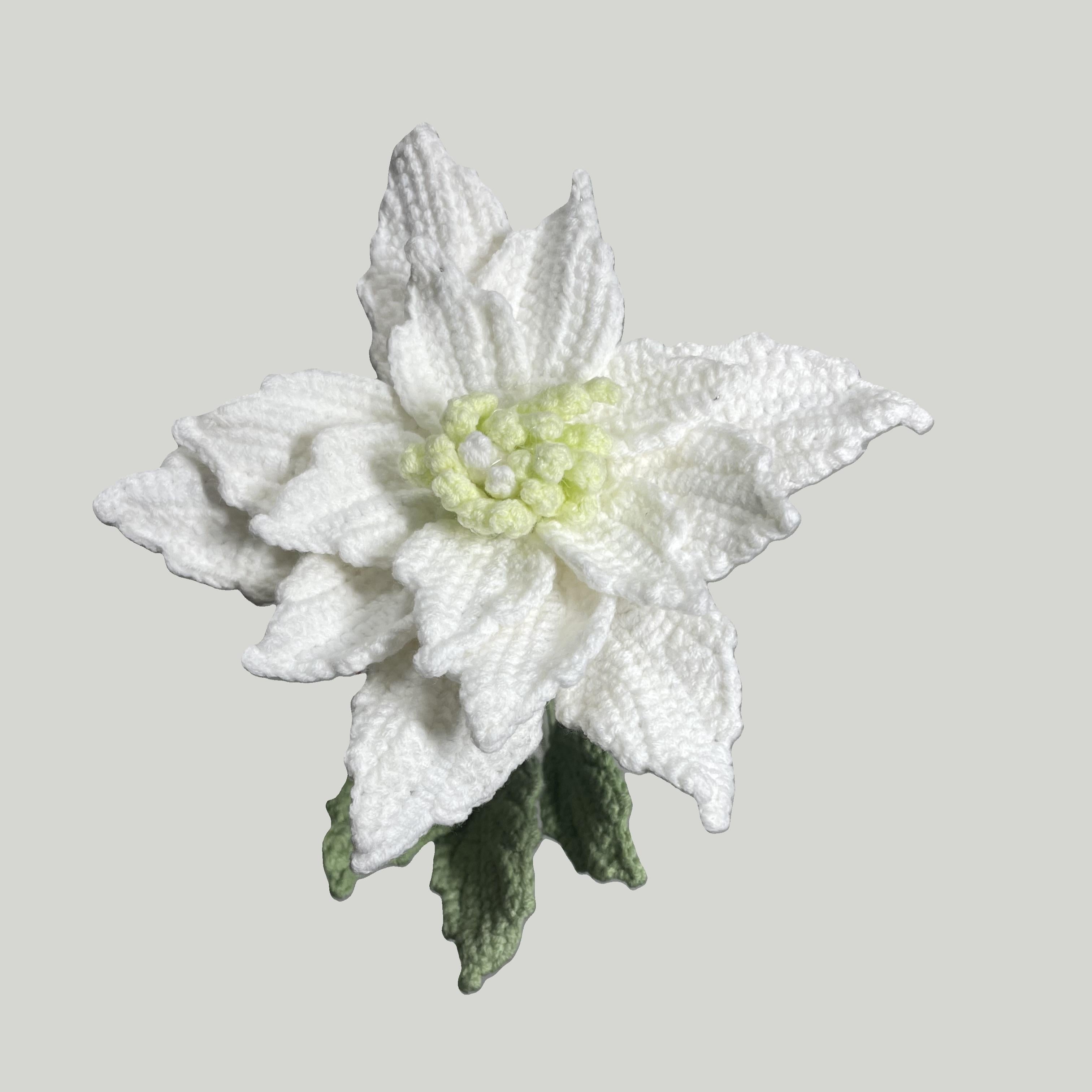 Handmade crochet Chinese rose flower in white yarn with green leaves for sustainable home decor and gifts
