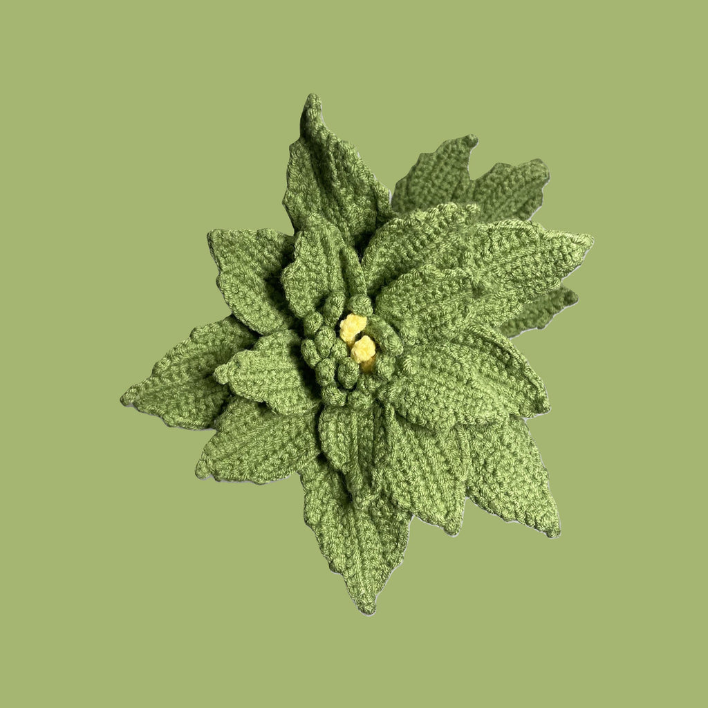 Handmade crochet Chinese rose flower in olive drab with green leaves for sustainable home decor and gifts
