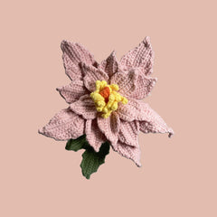 Handmade crochet Chinese rose flower in pink yarn with green leaves for sustainable home decor and gifts

