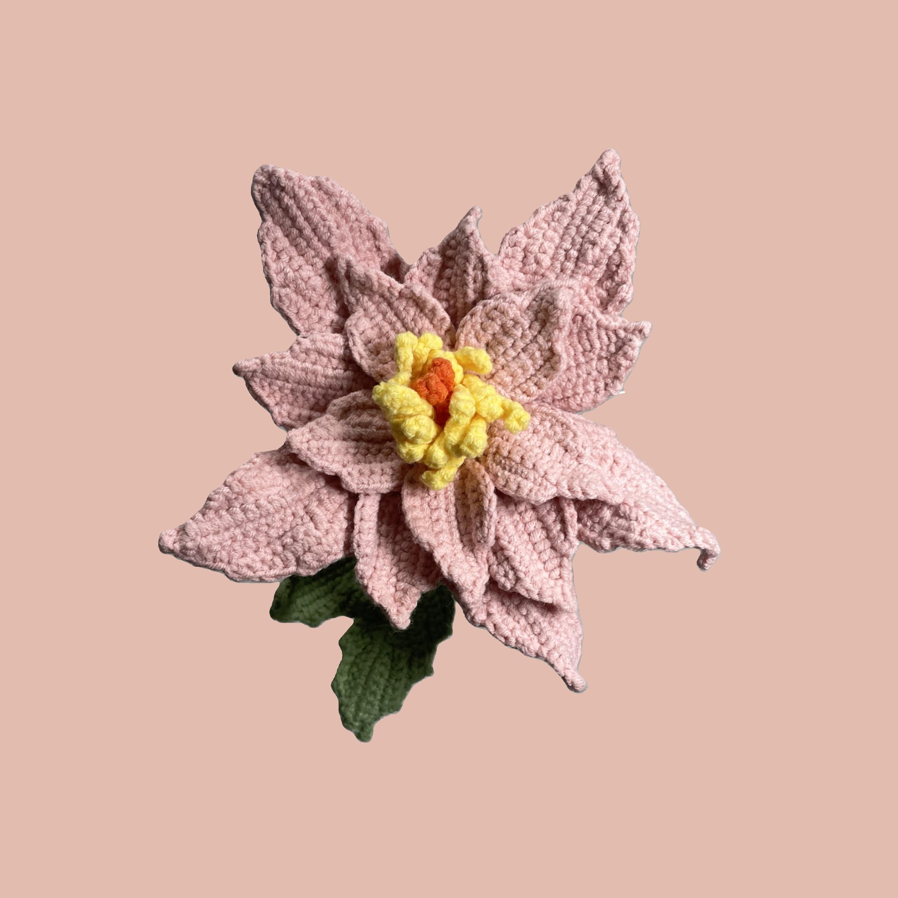 Handmade crochet Chinese rose flower in pink yarn with green leaves for sustainable home decor and gifts
