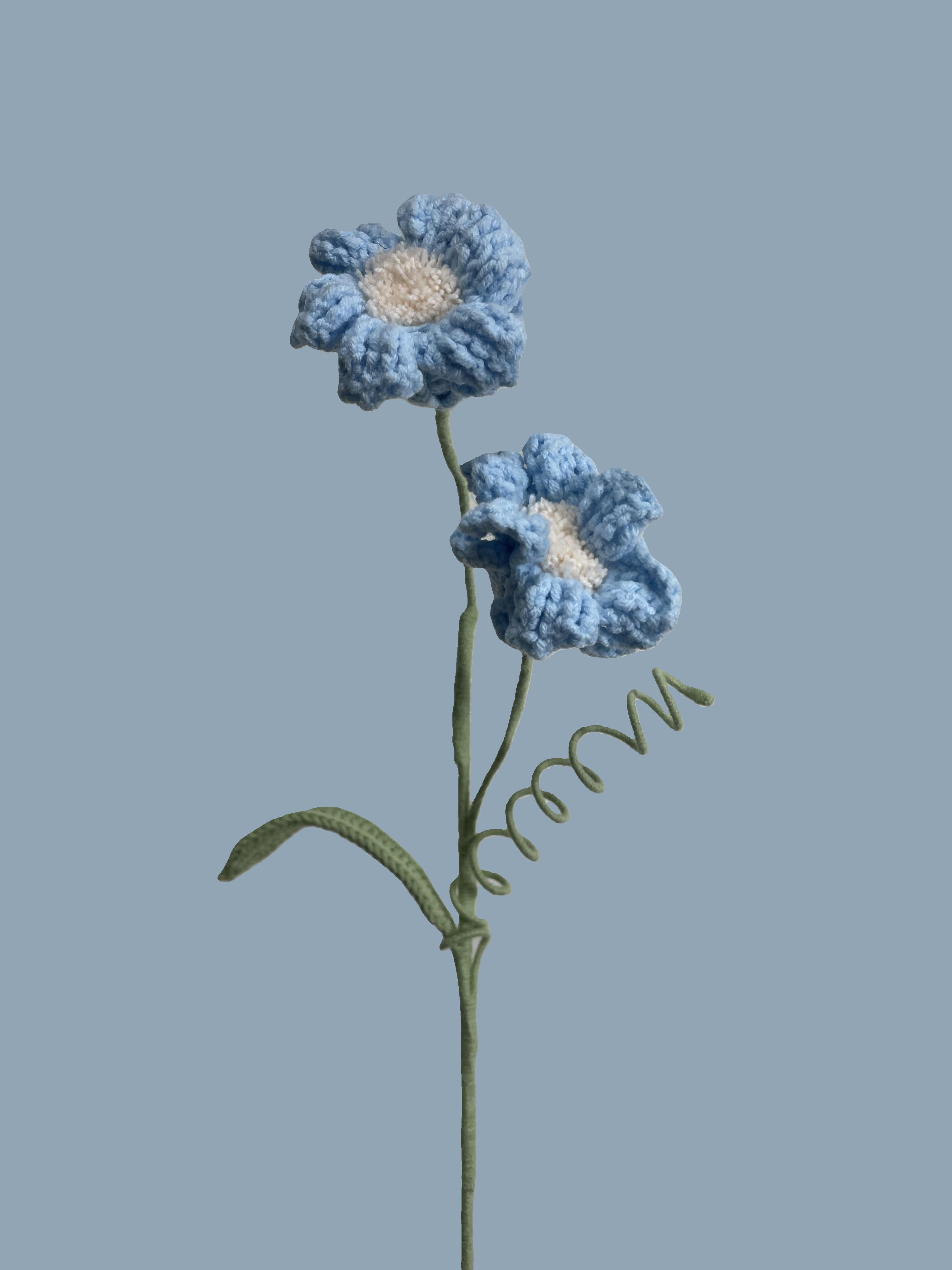 Handmade crochet daffodil flower in pale turquoise yarn, perfect for eco-friendly home decor and gifting
